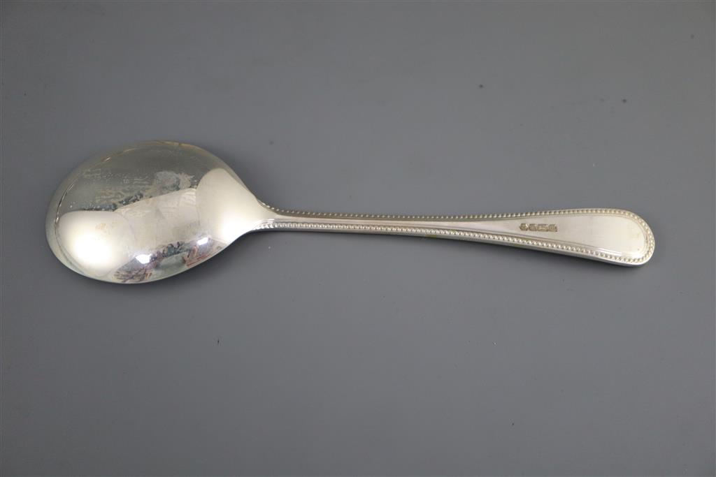 A modern part canteen of silver beaded Old English pattern flatware and cutlery, in mahogany case,